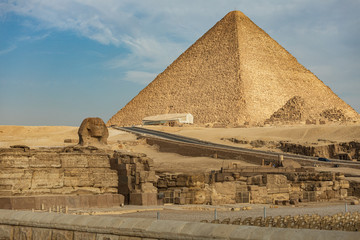 Fototapeta na wymiar Great Sphinx of Giza in front of pyramids