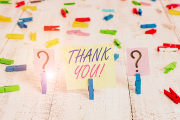Word writing text Thank You. Business photo showcasing polite expression used when acknowledging gift service compliment Scribbled and crumbling sheet with paper clips placed on the wooden table