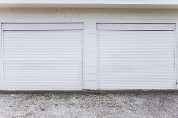 Fototapeta na wymiar Two white garage doors. Garage doors in the house