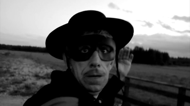 Fencing battle. Man in mask with sword drawing fire letter V, revenge, battle, conflict. Sign, symbol, fire