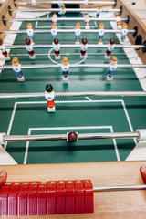Table football game with red and blue players. Football game.