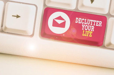 Writing note showing Declutter Your Life. Business concept for To eliminate extraneous things or information in life