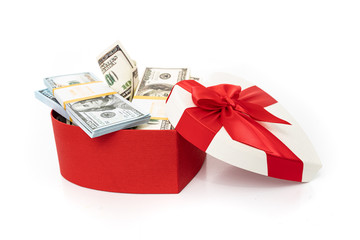 Dollars in a  gift box on a white background.  Valentine's Day. Birthday. Saving money.