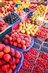 Fresh, juicy fruits at a market under the open sky
