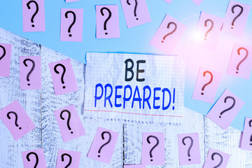 Conceptual hand writing showing Be Prepared. Concept meaning try be always ready to do or deal with something Crumbling papers with thick cardboard on the wooden table