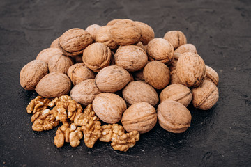 Walnuts on black background are ready to eat.