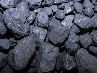 Pile of carbon stones grouped in a pile forming a beautiful background