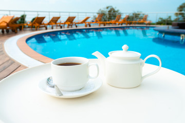 tea set on plate near spa pool