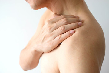 men have neck pain, shoulder pain in the room. health concept.