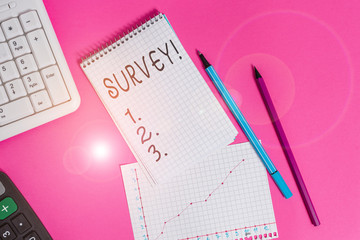 Handwriting text Survey. Conceptual photo research method used for collecting data from a predefined group Writing equipments and computer stuffs placed above colored plain table