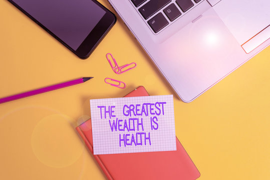 Conceptual hand writing showing The Greatest Wealth Is Health. Concept meaning Many sacrifice their money just to be healthy Laptop smartphone clip pencil paper sheet colored background