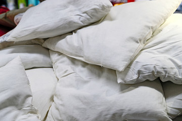 Fototapeta na wymiar Lots of soft, comfortable new pillows