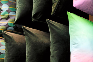 Multi-colored down soft pillows are shot close-up.