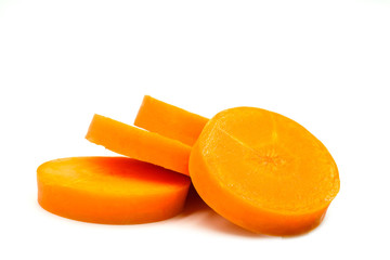 Fototapeta na wymiar Carrots cut into four slices On a white background, health concept