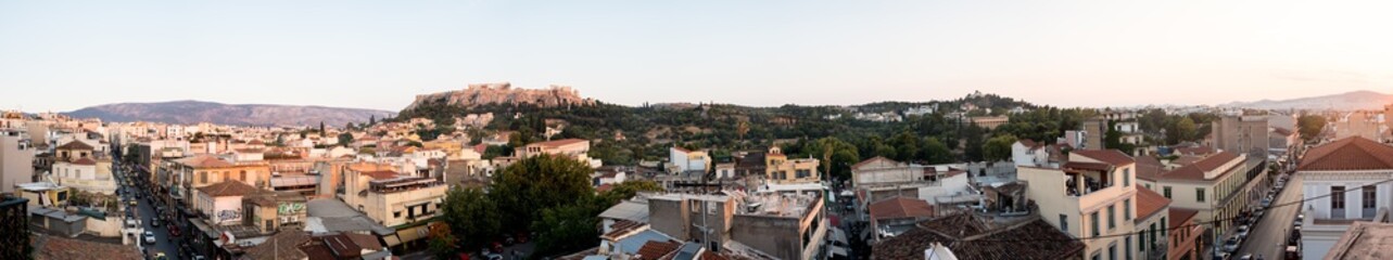 Fototapeta na wymiar Looking across the Athena Athens cityscape in Greece at the Acropolis at sunset