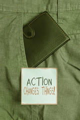 Writing note showing Action Changes Things. Business concept for start doing something against...