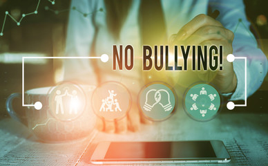 Conceptual hand writing showing No Bullying. Concept meaning stop aggressive behavior among...