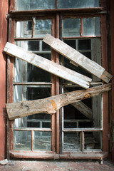 old window with broken glass and wooden frame