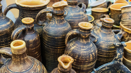 Fototapeta na wymiar Rustic clay jugs. National pottery. Environmentally friendly ceramic dishes