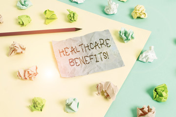 Fototapeta na wymiar Writing note showing Healthcare Benefits. Business concept for monthly fair market valueprovided to Employee dependents Colored crumpled papers empty reminder blue yellow clothespin
