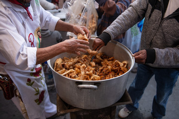 man cooking a typical Mexican meal known as 