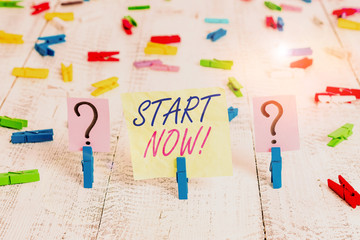 Word writing text Start Now. Business photo showcasing do not hesitate get working or doing stuff right away Scribbled and crumbling sheet with paper clips placed on the wooden table