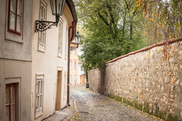 Novy Svet Street, an empty picturesque cobblestone medieval and narrow street of Hradcany hill in Prague, Czech Republic, with medieval houses and trees. It is a major touristic attraction