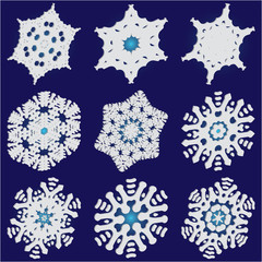 Set of christmas paper snowflakes on blue background.