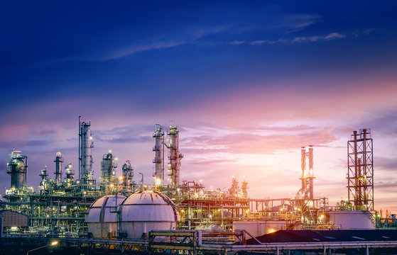 Oil and gas refinery plant or petrochemical industry on sky sunset background, Factory with evening, Manufacturing of petrochemical industrial