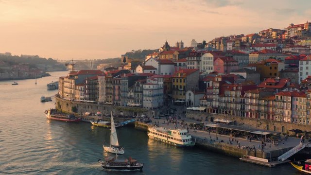 Porto, Portugal. Aerial view of the old city with promenade of the Douro river at sunset