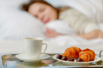 Bed and breakfast for attractive young woman sleeping