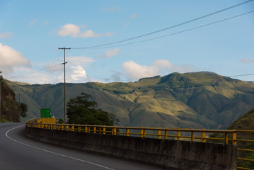 Road between mountains with safety rail on one side to avoid accidents. Colombia 