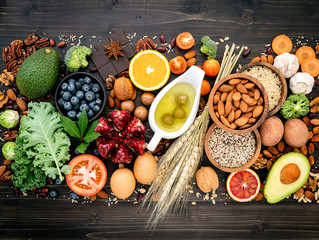 Ingredients for the healthy foods selection. The concept of healthy food set up on wooden background.