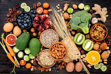Ingredients for the healthy foods selection. The concept of healthy food set up on wooden background.