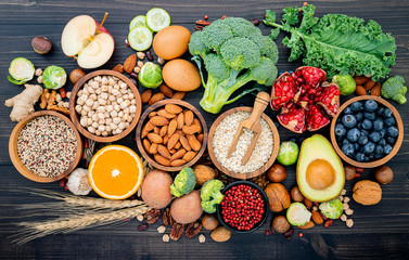 Ingredients for the healthy foods selection. The concept of healthy food set up on wooden background.