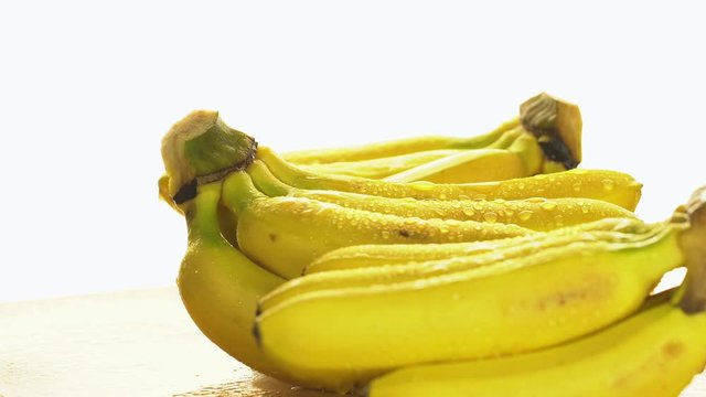 Bananas. A bunch of bananas rotates, an interesting foreshortening, an advertising shot.