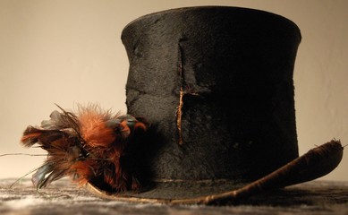 Torn Antique Black Top Hat With Feathers