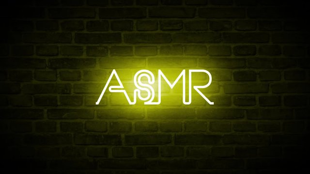 A high quality video of a neon sign that reads: ASMR