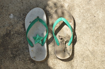 Old shoes were left on the side of the road.