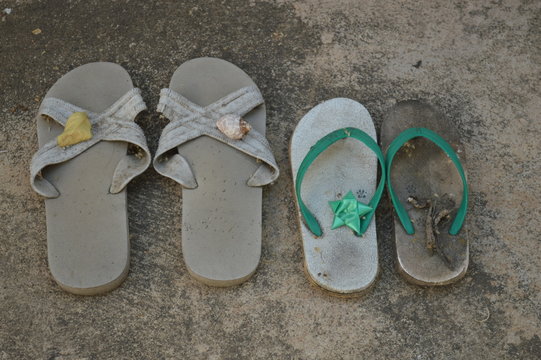 Old Shoes Were Left On The Side Of The Road.