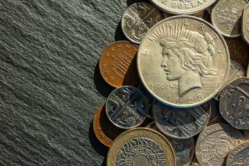 background. copper and silver coins of various denominations and values. dollar.