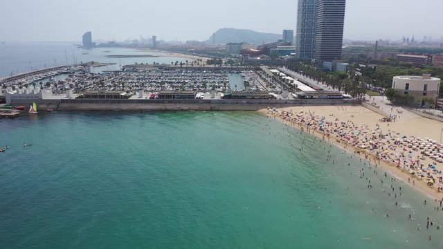 BARCELONA, SPAIN - JULY 07, 2019: Aerial panoramic view of modern Barcelona cityscape on Mediterranean coast