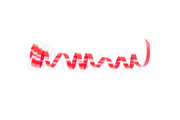 red shiny festive ribbon in the middle of the image on a white background top view