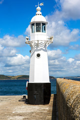 Lighthouse on the outer Harbour Wall at Mevagissey Cornwall England UK Europe