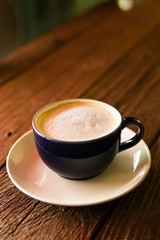 cup of coffee on wooden table