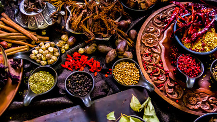 Top view Thai spices and herbs ingredient decoration on wood table for cook in home kitchen. 