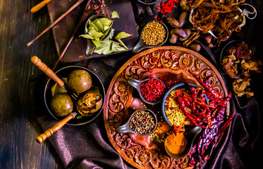 Top view Thai spices and herbs ingredient decoration on wood table for cook in home kitchen. 
