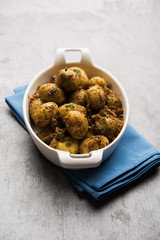 Jeera Aloo - Potatoes Flavoured With Cumin seeds and spices. popular Indian main course recipe. served in a bowl. selective focus