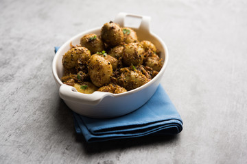 Jeera Aloo - Potatoes Flavoured With Cumin seeds and spices. popular Indian main course recipe. served in a bowl. selective focus