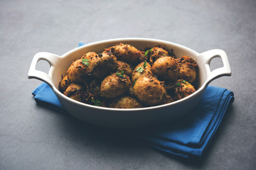 Jeera Aloo - Potatoes Flavoured With Cumin seeds and spices. popular Indian main course recipe. served in a bowl. selective focus